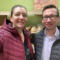 Two LSV attorneys smile for a photo from inside the foodshelf